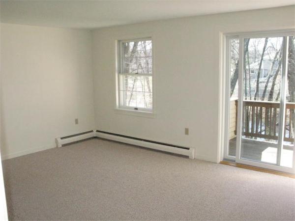 20 1/2 Webb Street, Unit 2A Middleton, MA 01949 - Photo 5 of 17 an empty room with windows