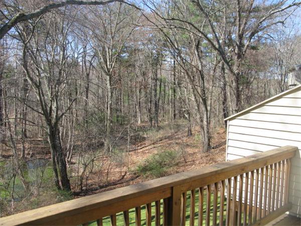 20 1/2 Webb Street, Unit 2A Middleton, MA 01949 - Photo 8 of 17 a view of a balcony with trees