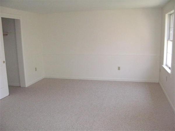 20 1/2 Webb Street, Unit 2A Middleton, MA 01949 - Photo 10 of 17 an empty room with a window