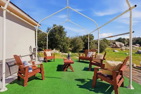 a view of yard with patio