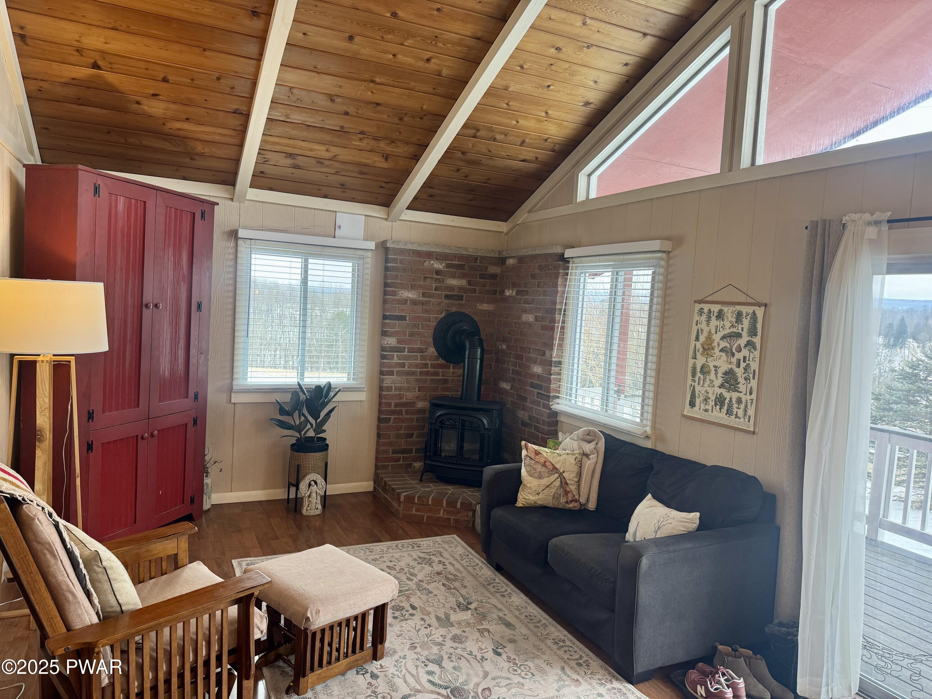 360 South Baker Road Waymart, PA 18472 - Photo 7 of 35 a living room with furniture a table and wooden floor