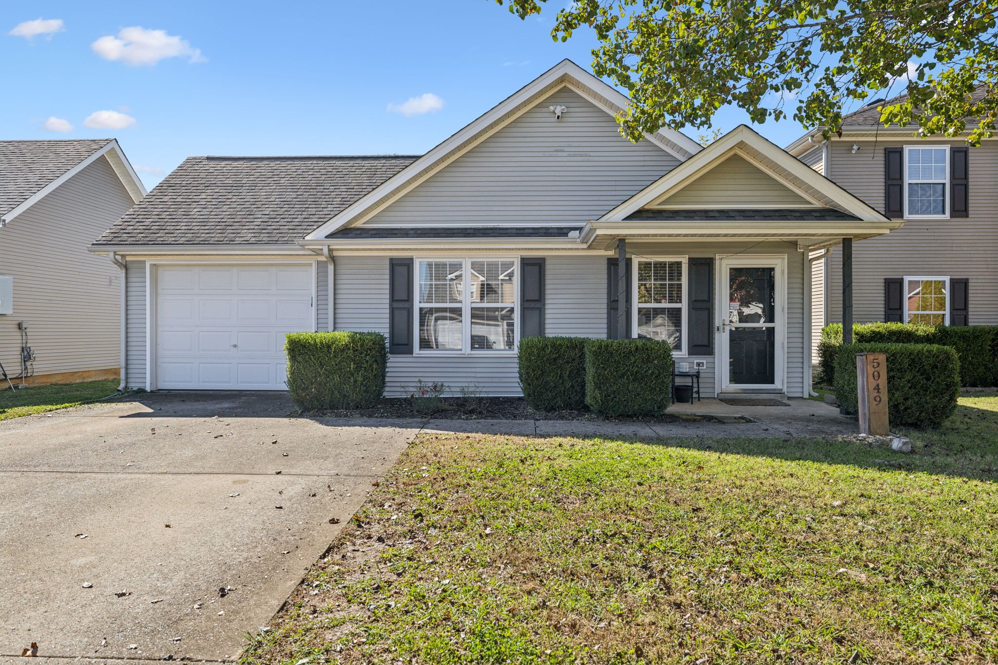 a view of a house with a yard and plants