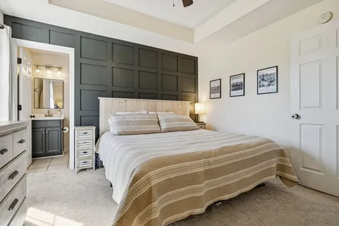 a bedroom with a bed and a cabinets