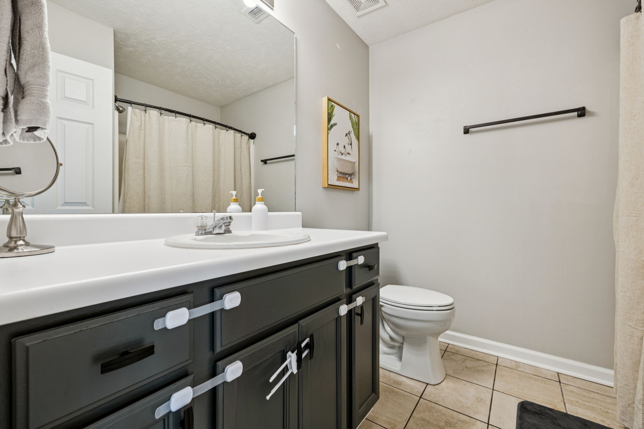 5049 Tabitha Street Murfreesboro, TN 37129 - Photo 16 of 28 a bathroom with a sink a toilet a mirror and shower