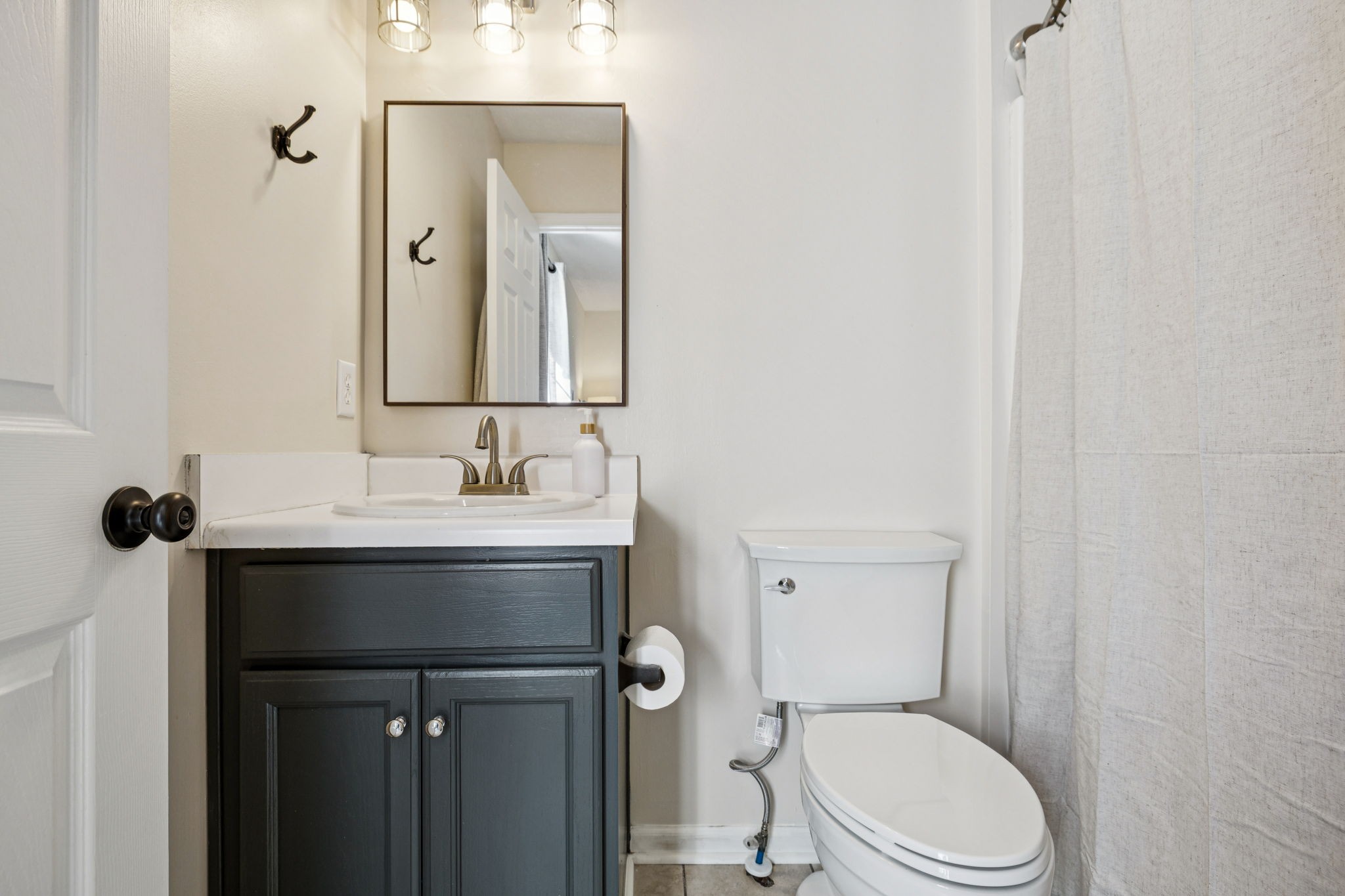 5049 Tabitha Street Murfreesboro, TN 37129 - Photo 22 of 28 a bathroom with a sink a toilet and shower