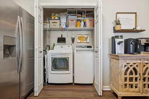 a utility room with closet dryer and washer