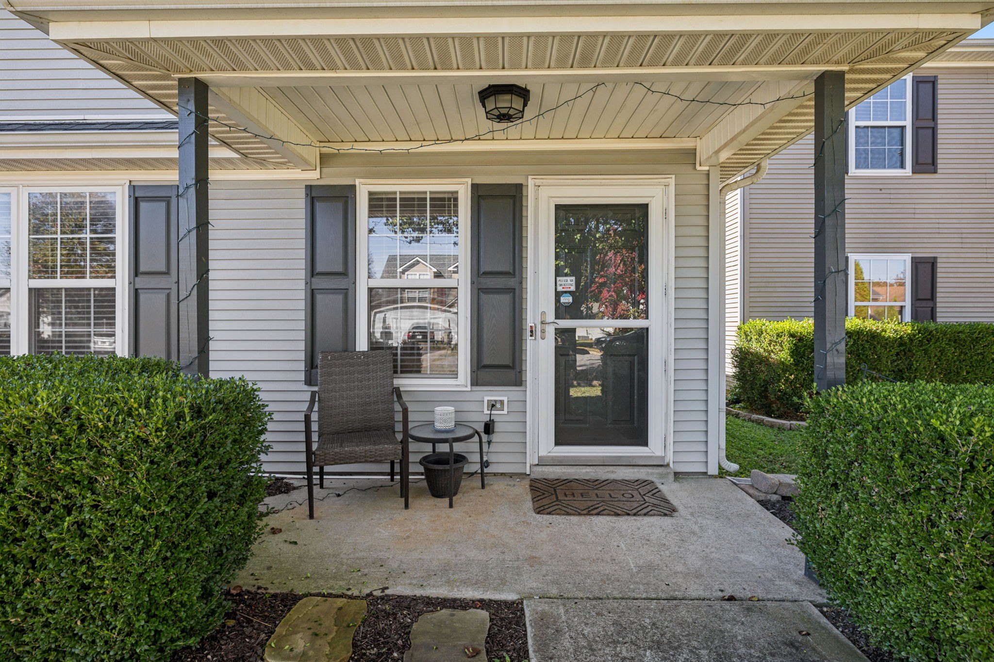 5049 Tabitha Street Murfreesboro, TN 37129 - Photo 3 of 28 a front view of a house with outdoor seating and plants