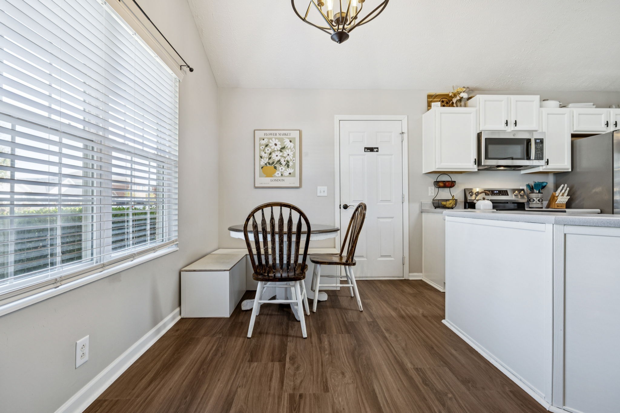 5049 Tabitha Street Murfreesboro, TN 37129 - Photo 10 of 28 a view of a dining room with furniture and wooden floor