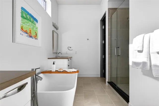 a bathroom with a tub and a sink