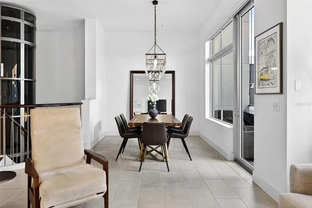 a dining room with furniture and window