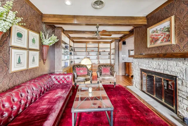 a bedroom with a bed and ceiling fan