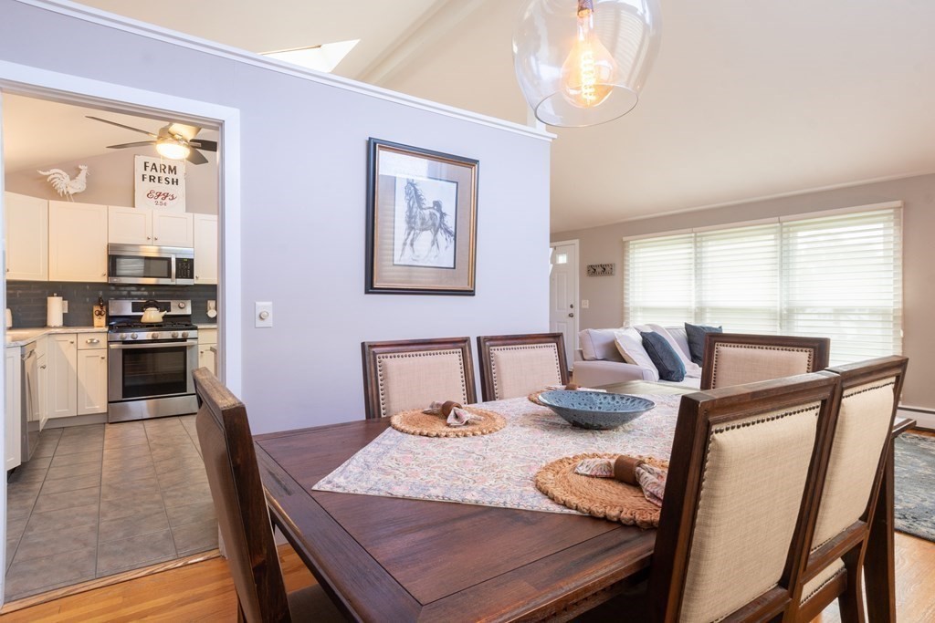 64 Hills Ferry Road Nashua, NH 03064 - Photo 12 of 34 a dining room with furniture and window