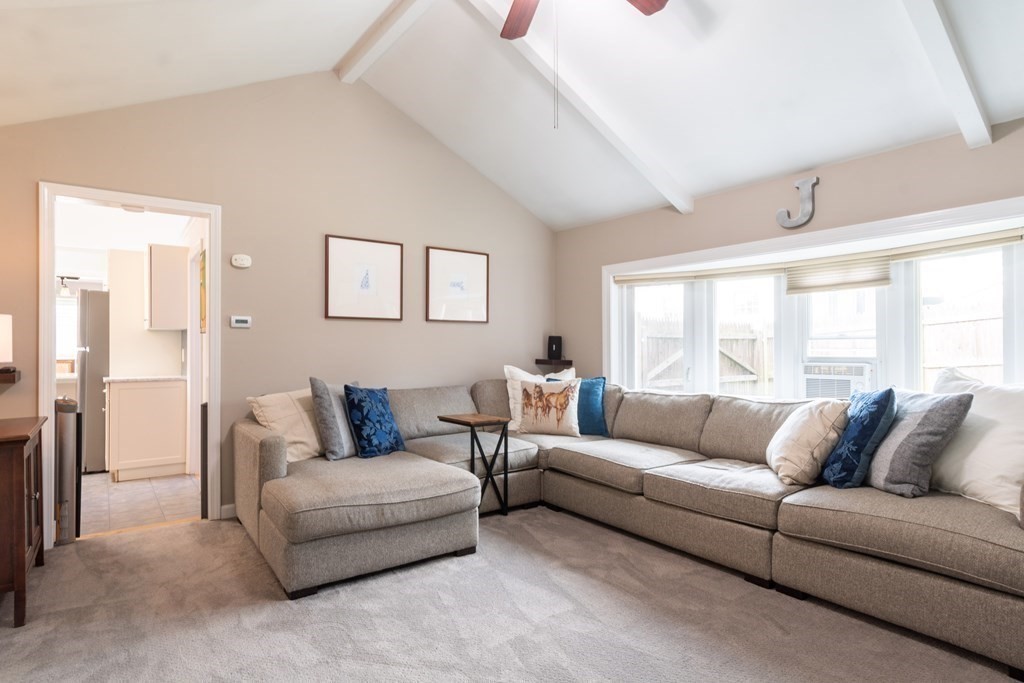 64 Hills Ferry Road Nashua, NH 03064 - Photo 15 of 34 a living room with furniture and a large window