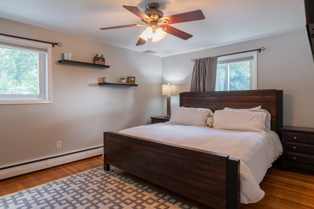 64 Hills Ferry Road Nashua, NH 03064 - Photo 17 of 34 a bedroom with a bed and a window