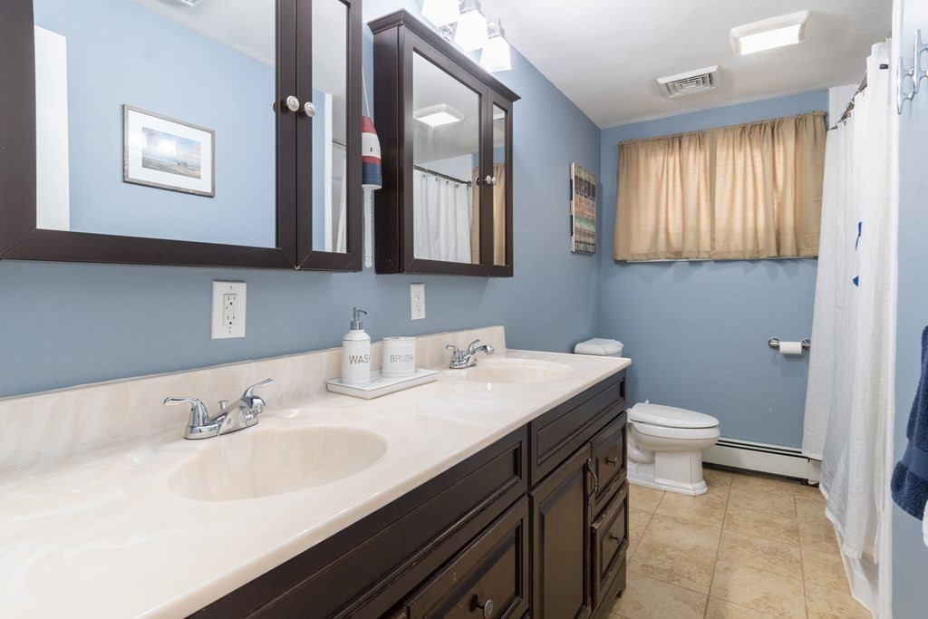 64 Hills Ferry Road Nashua, NH 03064 - Photo 26 of 34 a bathroom with a sink and a toilet