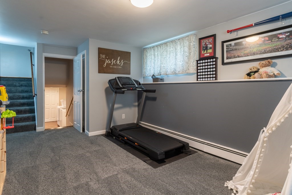 64 Hills Ferry Road Nashua, NH 03064 - Photo 28 of 34 a room with painting and a table