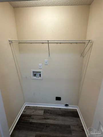 an empty room with wooden floor