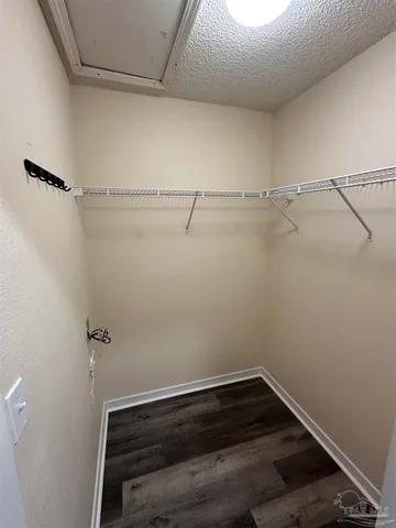 a view of a room with racks on the wall