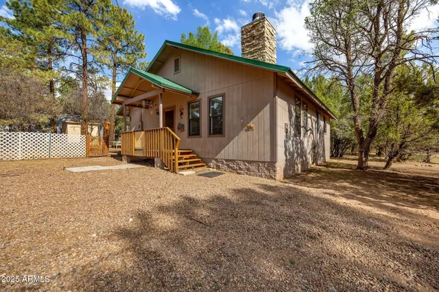 a view of a house with snow on the road