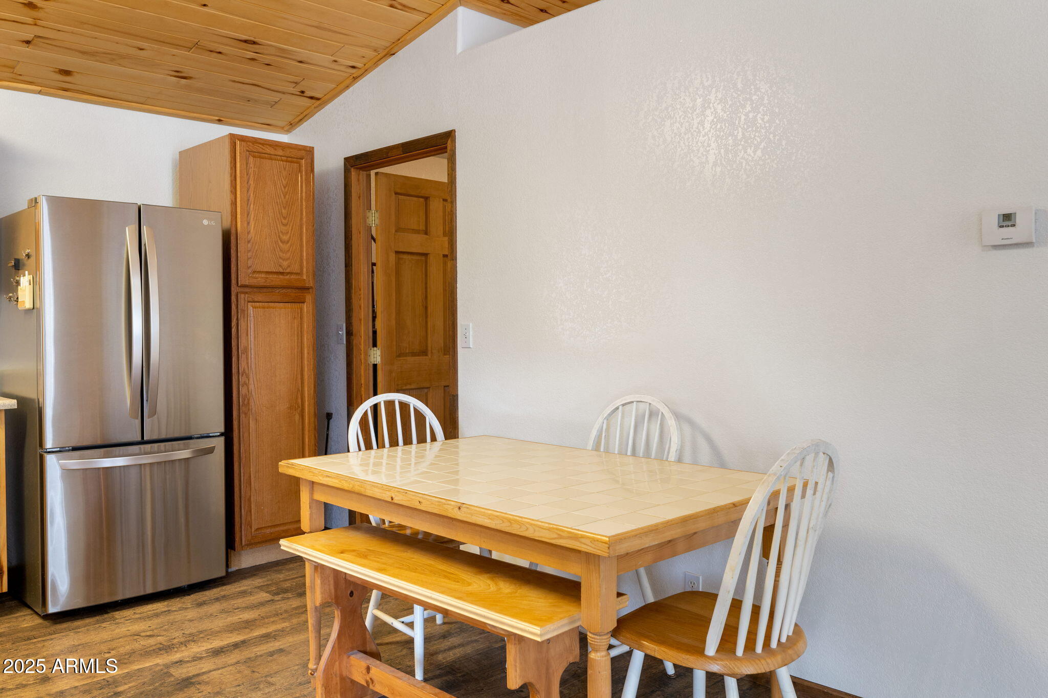 2882 Verde Road Overgaard, AZ 85933 - Photo 11 of 33 a kitchen with a sink a refrigerator and cabinets