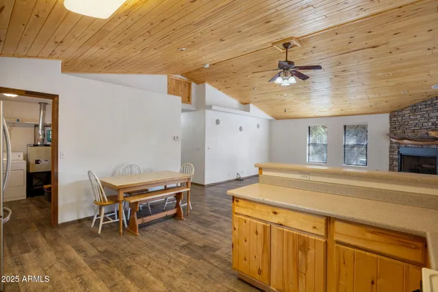 a kitchen with stainless steel appliances a stove microwave and a sink