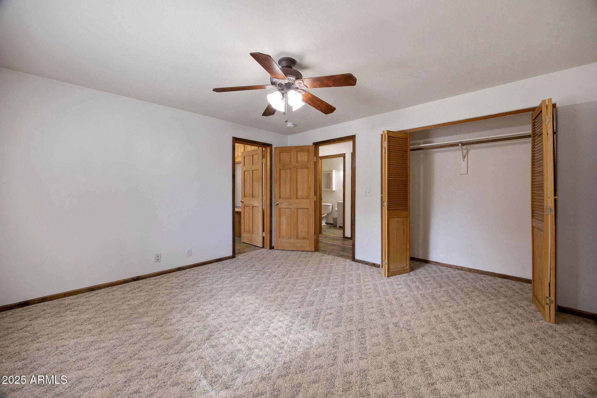 2882 Verde Road Overgaard, AZ 85933 - Photo 16 of 33 a view of an empty room and chandelier fan