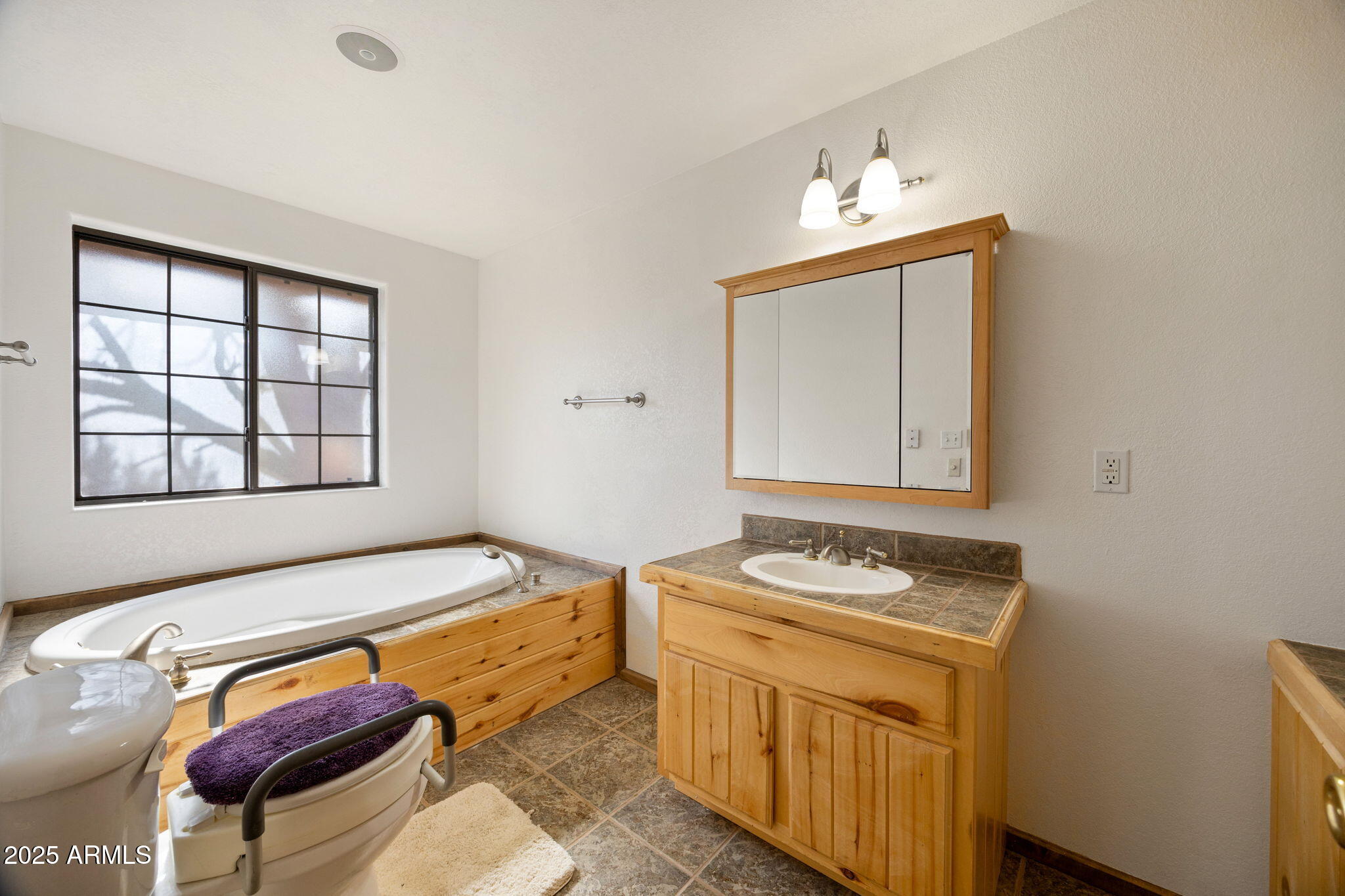 2882 Verde Road Overgaard, AZ 85933 - Photo 17 of 33 a bedroom with a bed and a window