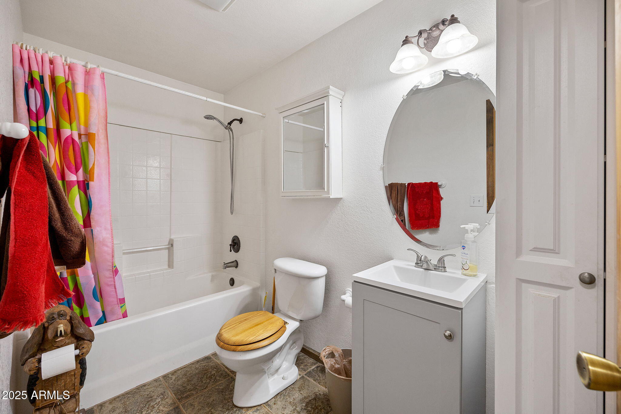 2882 Verde Road Overgaard, AZ 85933 - Photo 20 of 33 a bathroom with a sink a toilet and a mirror