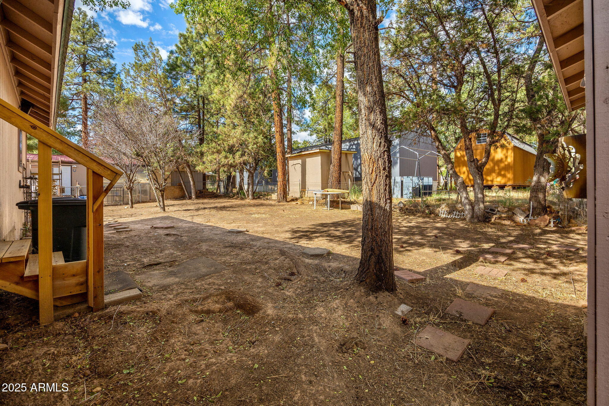 2882 Verde Road Overgaard, AZ 85933 - Photo 25 of 33 a view of a yard with wooden fence