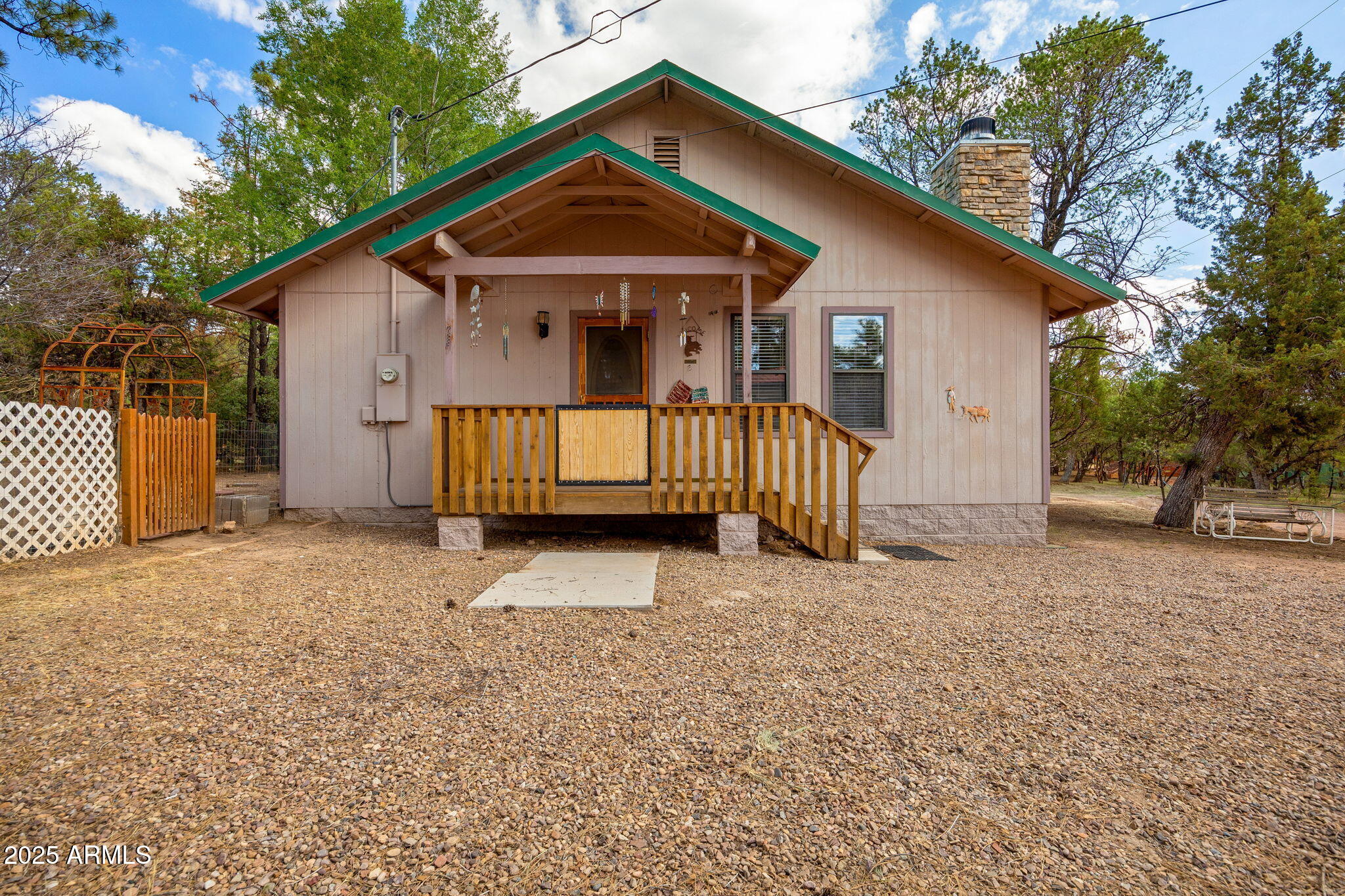 2882 Verde Road Overgaard, AZ 85933 - Photo 3 of 33 a front view of a house with a yard and garage