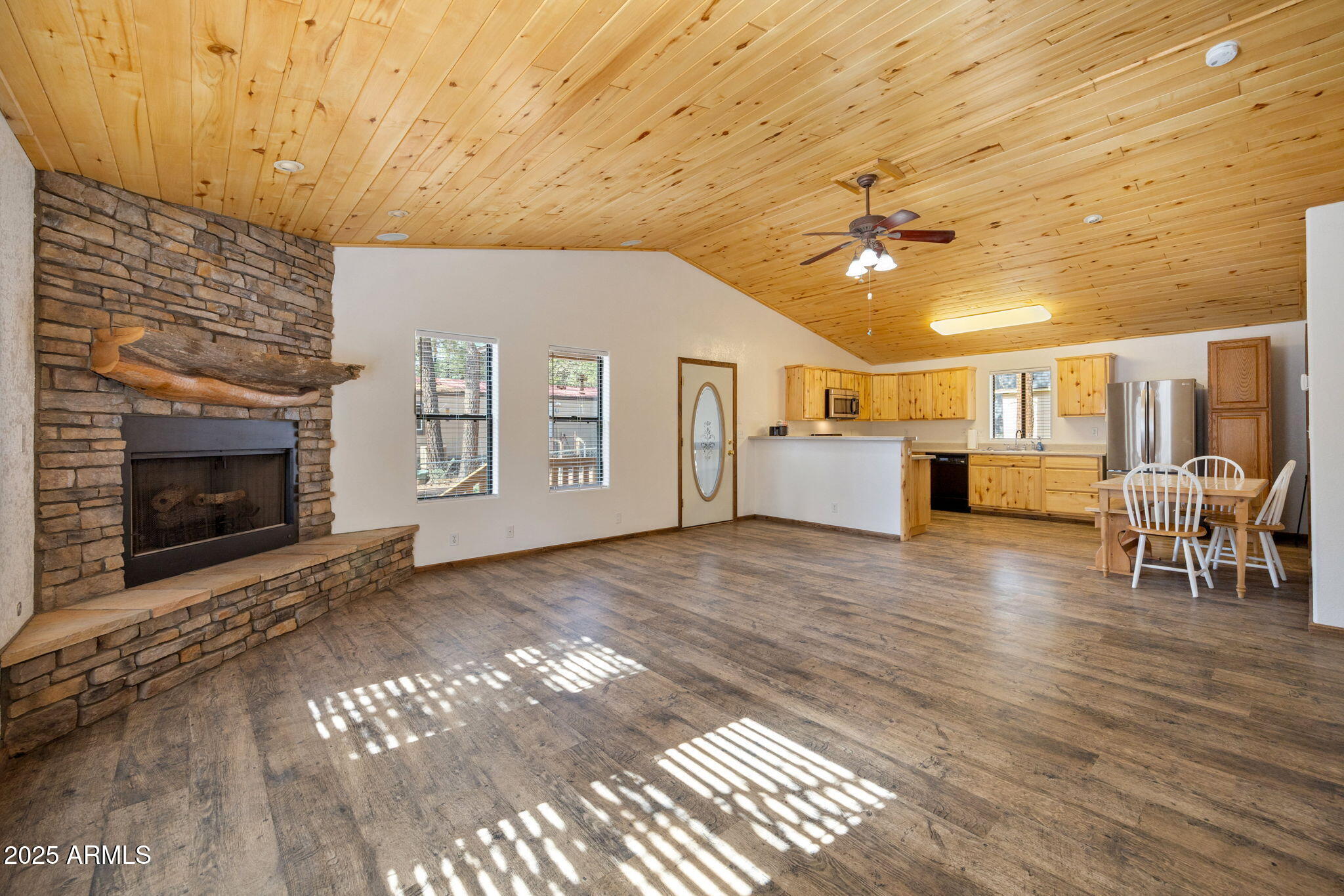 2882 Verde Road Overgaard, AZ 85933 - Photo 8 of 33 a view of a livingroom with furniture and a fireplace