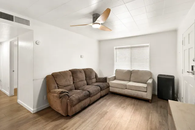 a living room with furniture and a window