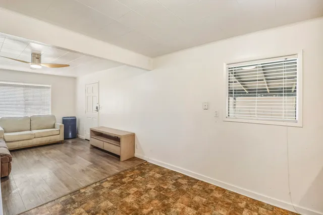 a kitchen with granite countertop a refrigerator a stove a sink and dishwasher