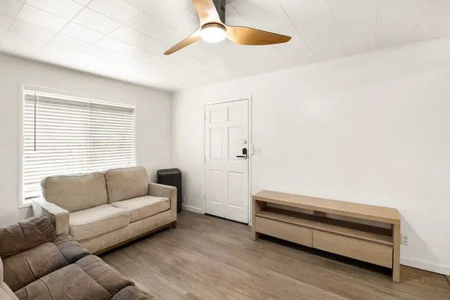 a living room with furniture and a window