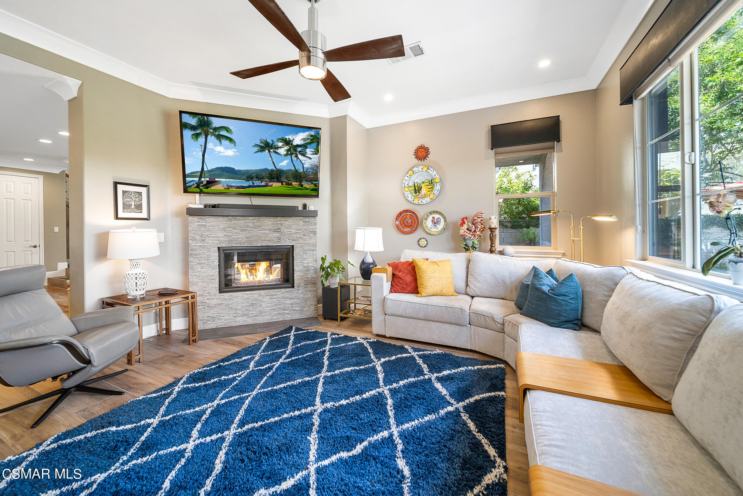 4150 Via Mira Monte Calabasas, CA 91301 - Photo 11 of 41 a living room with furniture a flat screen tv and a fireplace