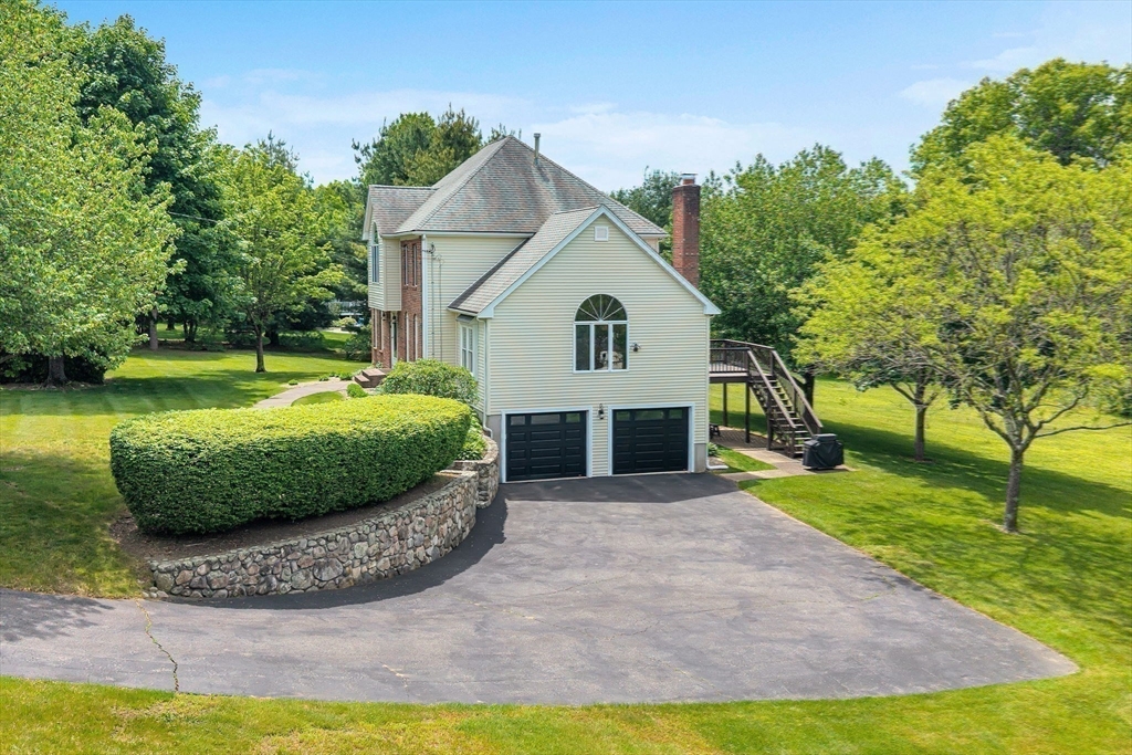 83 Jefferson Road Franklin, MA 02038 - Photo 28 of 34 a view of a house with a yard and sitting area