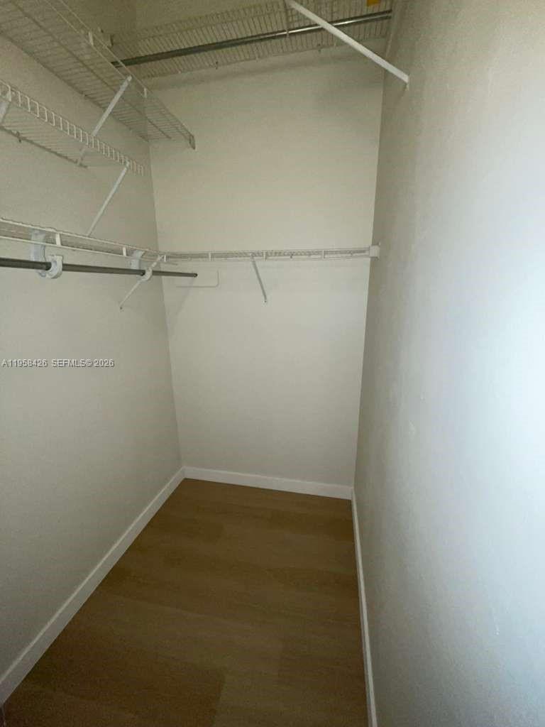 3356 Bird Avenue, Unit 5 Miami, FL 33133 - Photo 5 of 15 a view of a room with racks on the wall