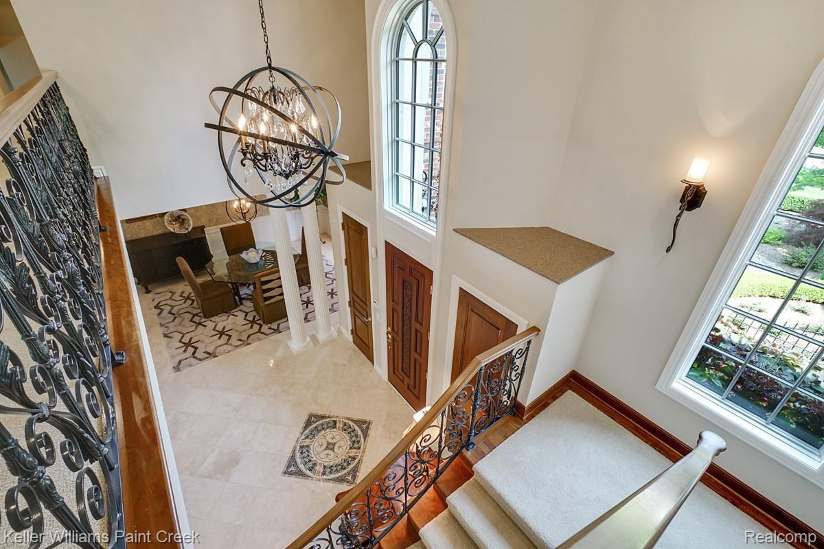 4902 Crestone Way Rochester, MI 48306 - Photo 41 of 70 View of the impressive Foyer entrance with marble floors and modern fixtures.