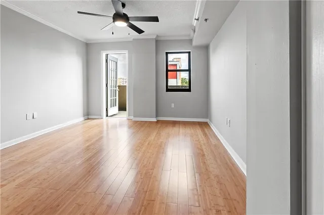 wooden floor in an empty room with a window