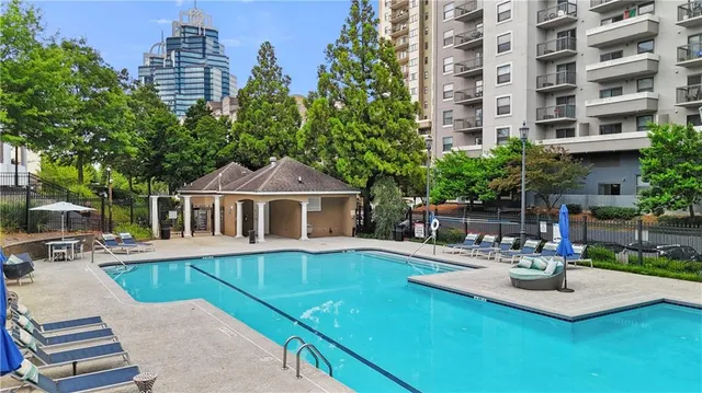 a view of a house with patio and a yard