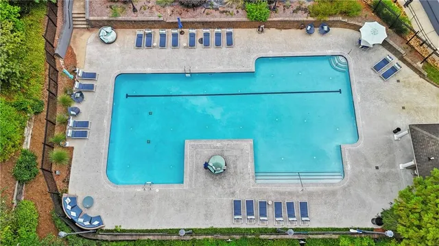 an aerial view of a house with garden space and street view