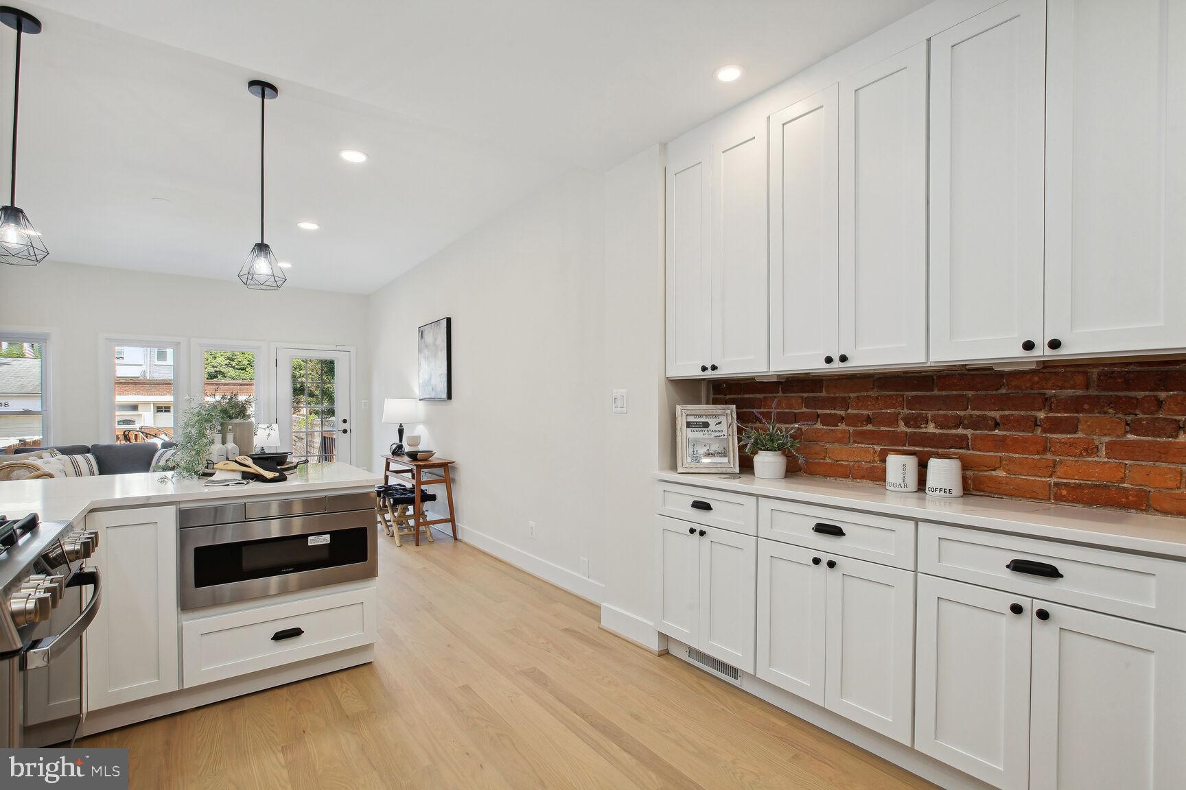 3543 S Street Northwest Washington, DC 20007 - Photo 11 of 31 Open kitchen design with wall of pantry cabinets