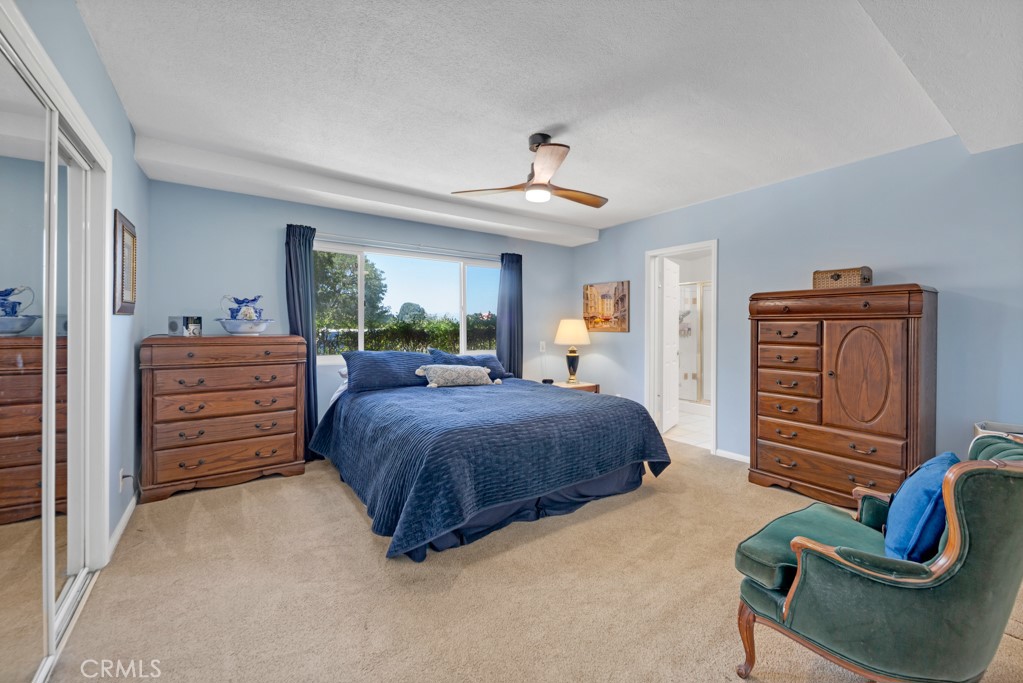 23714 Lawnside Drive Newhall, CA 91321 - Photo 32 of 48 a spacious bedroom with a bed and furniture