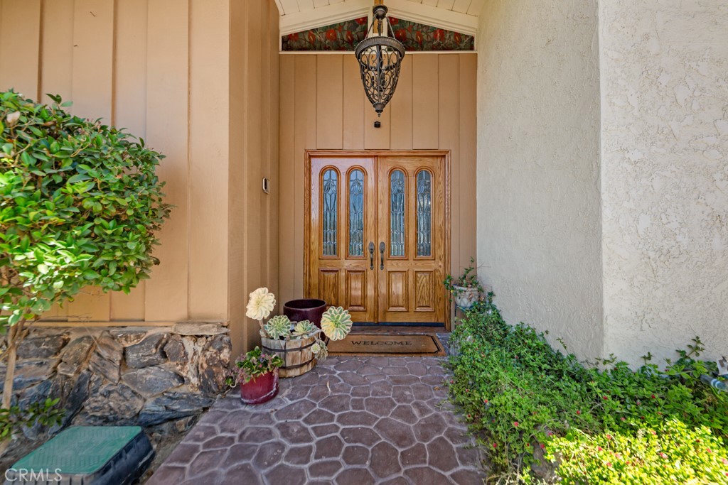 23714 Lawnside Drive Newhall, CA 91321 - Photo 4 of 48 a view of a door and chair in the patio