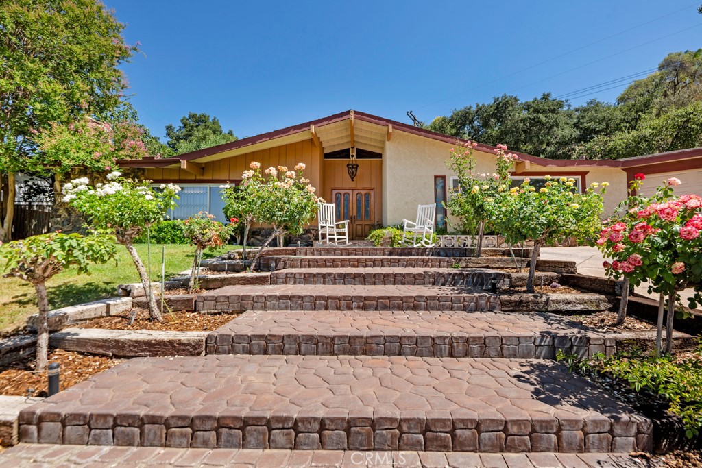 23714 Lawnside Drive Newhall, CA 91321 - Photo 7 of 48 a front view of a house with a yard