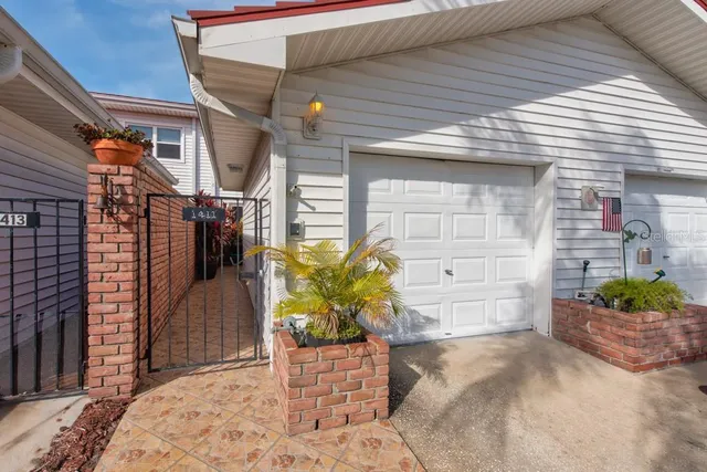 a view of front door and potted plants