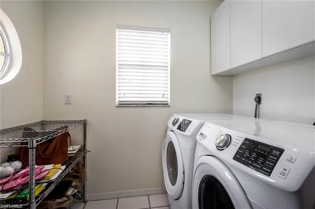 a view of storage and utility room with washer and dryer