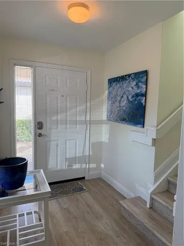 a view of livingroom with furniture and front door