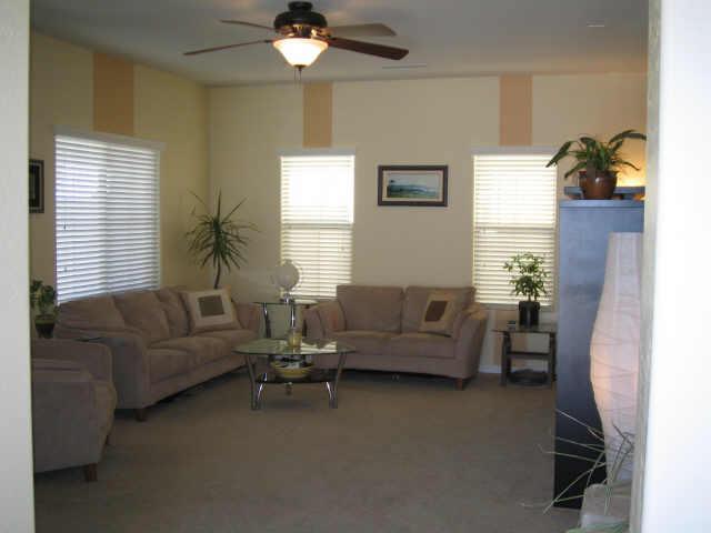 1920 West Davis Road Phoenix, AZ 85023 - Photo 2 of 8 a living room with furniture and a window