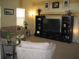 1920 West Davis Road Phoenix, AZ 85023 - Photo 3 of 8 a living room with furniture a flat screen tv and a fireplace